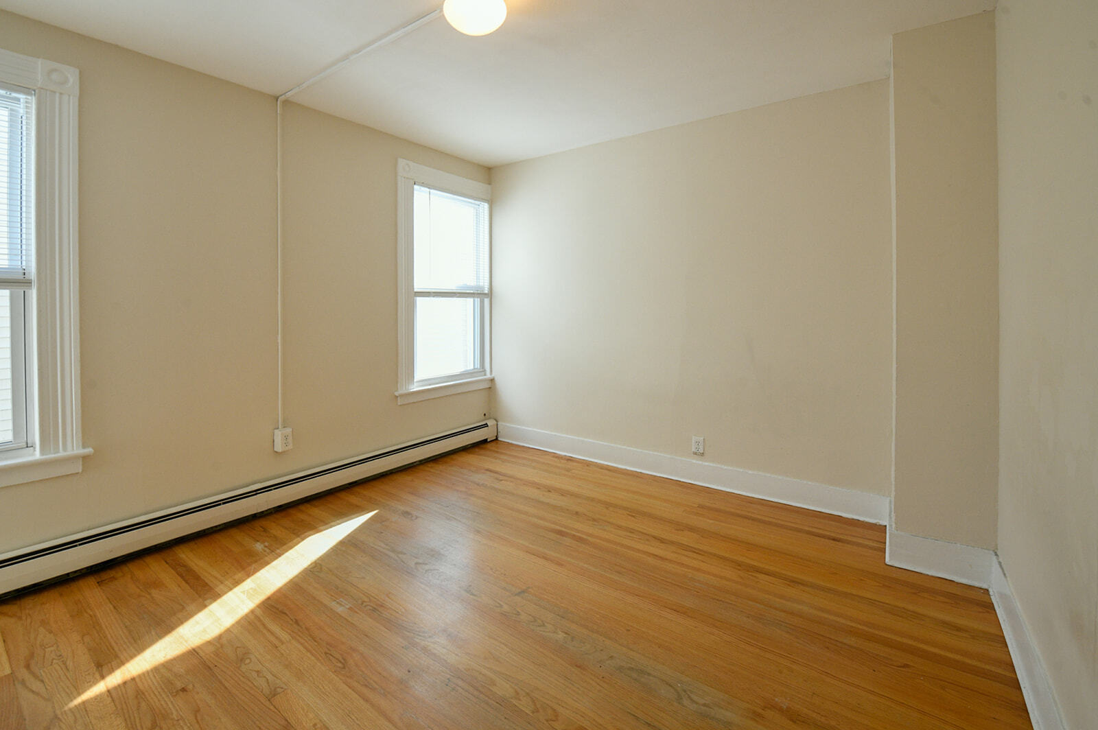63 New Britain Avenue, Unit 1 Farmington, CT 06085 - Photo 12 of 25 a view of room with window and wooden floor