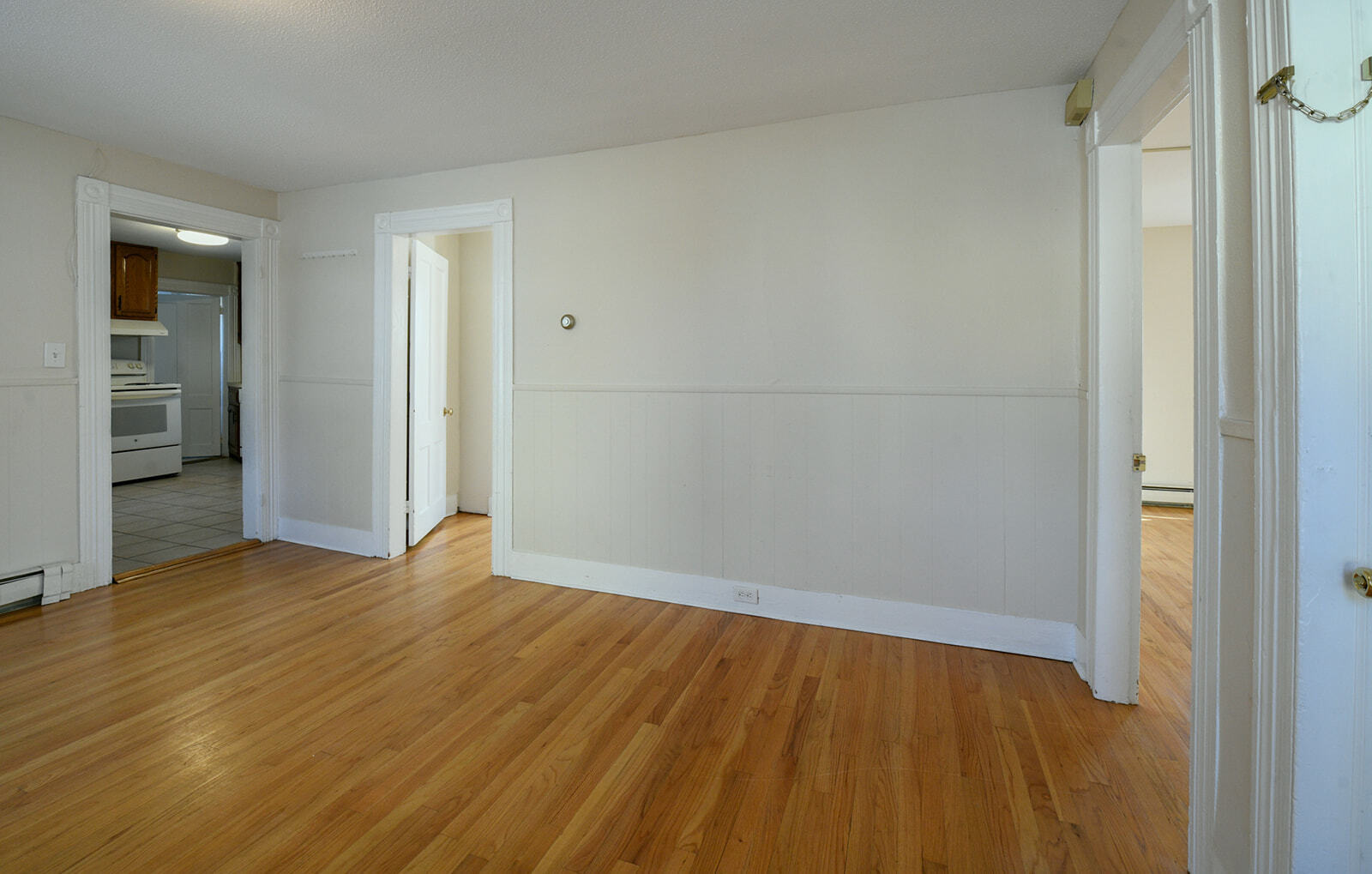 63 New Britain Avenue, Unit 1 Farmington, CT 06085 - Photo 16 of 25 a view of an empty room with wooden floor and a window