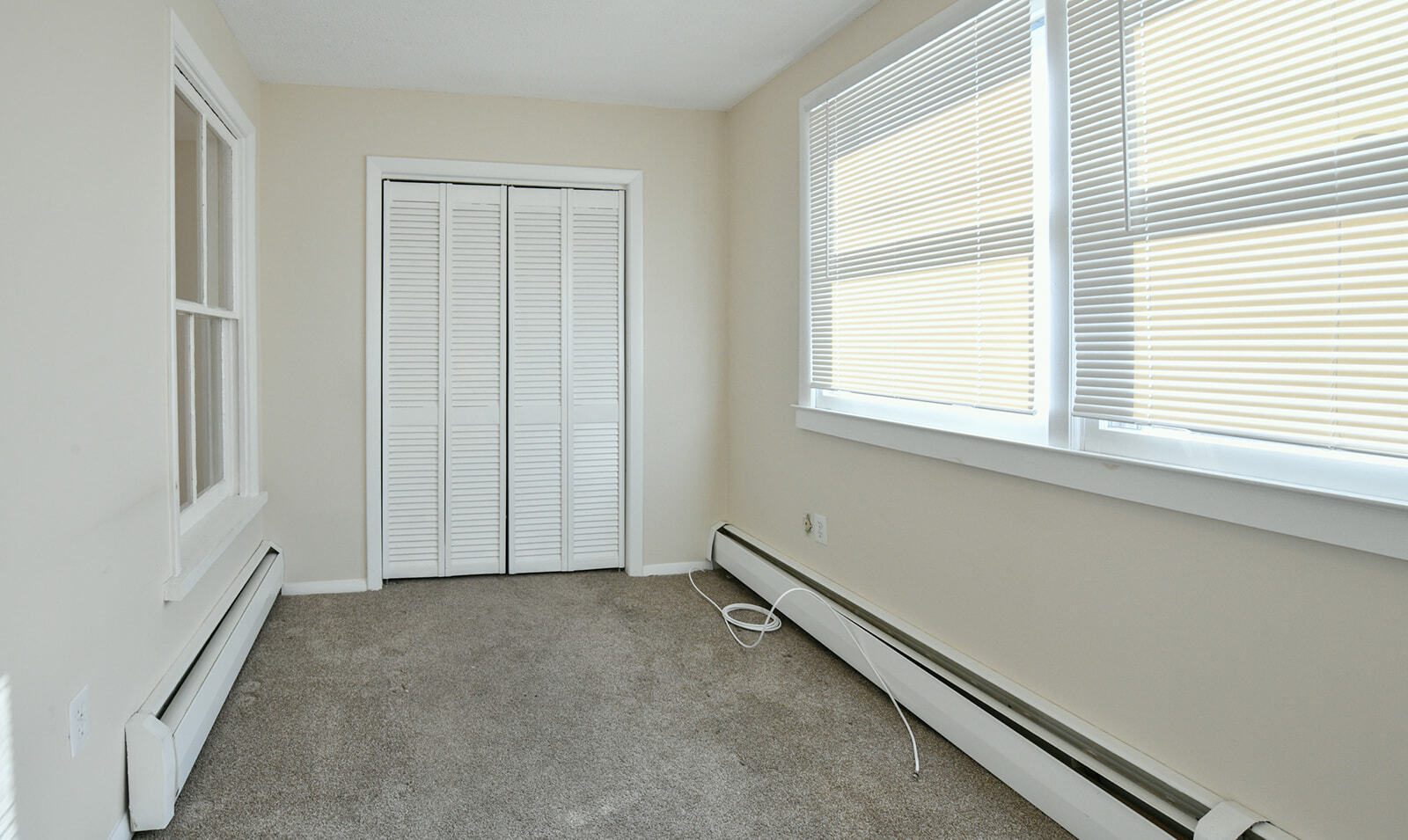 63 New Britain Avenue, Unit 1 Farmington, CT 06085 - Photo 20 of 25 a view of a room that has a window in it