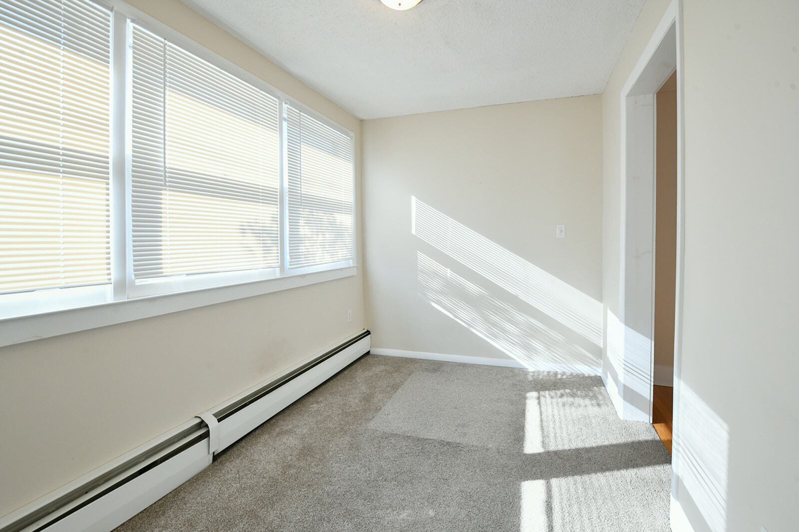 63 New Britain Avenue, Unit 1 Farmington, CT 06085 - Photo 21 of 25 a view of an empty room and window
