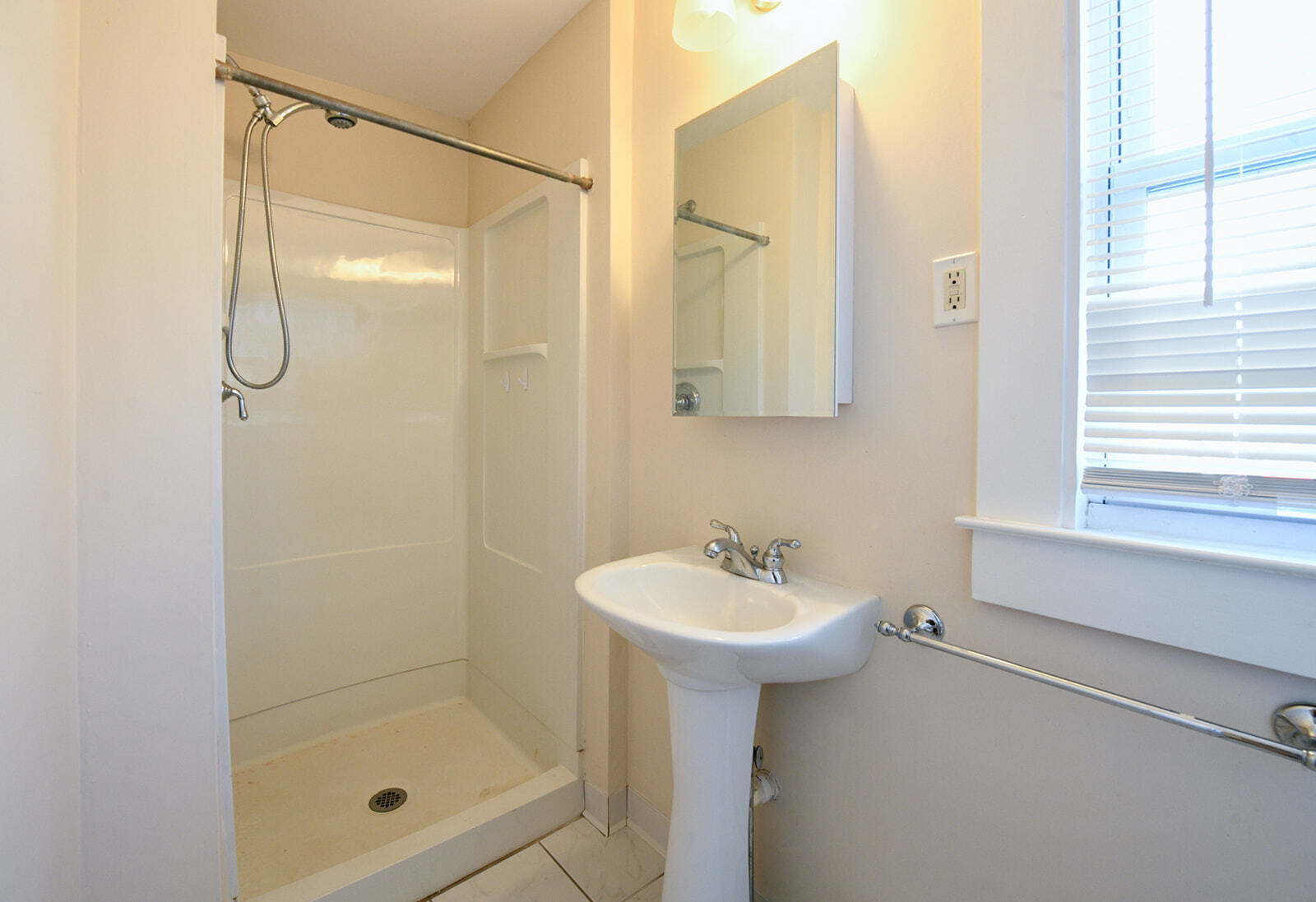 63 New Britain Avenue, Unit 1 Farmington, CT 06085 - Photo 8 of 25 a bathroom with a shower sink and mirror