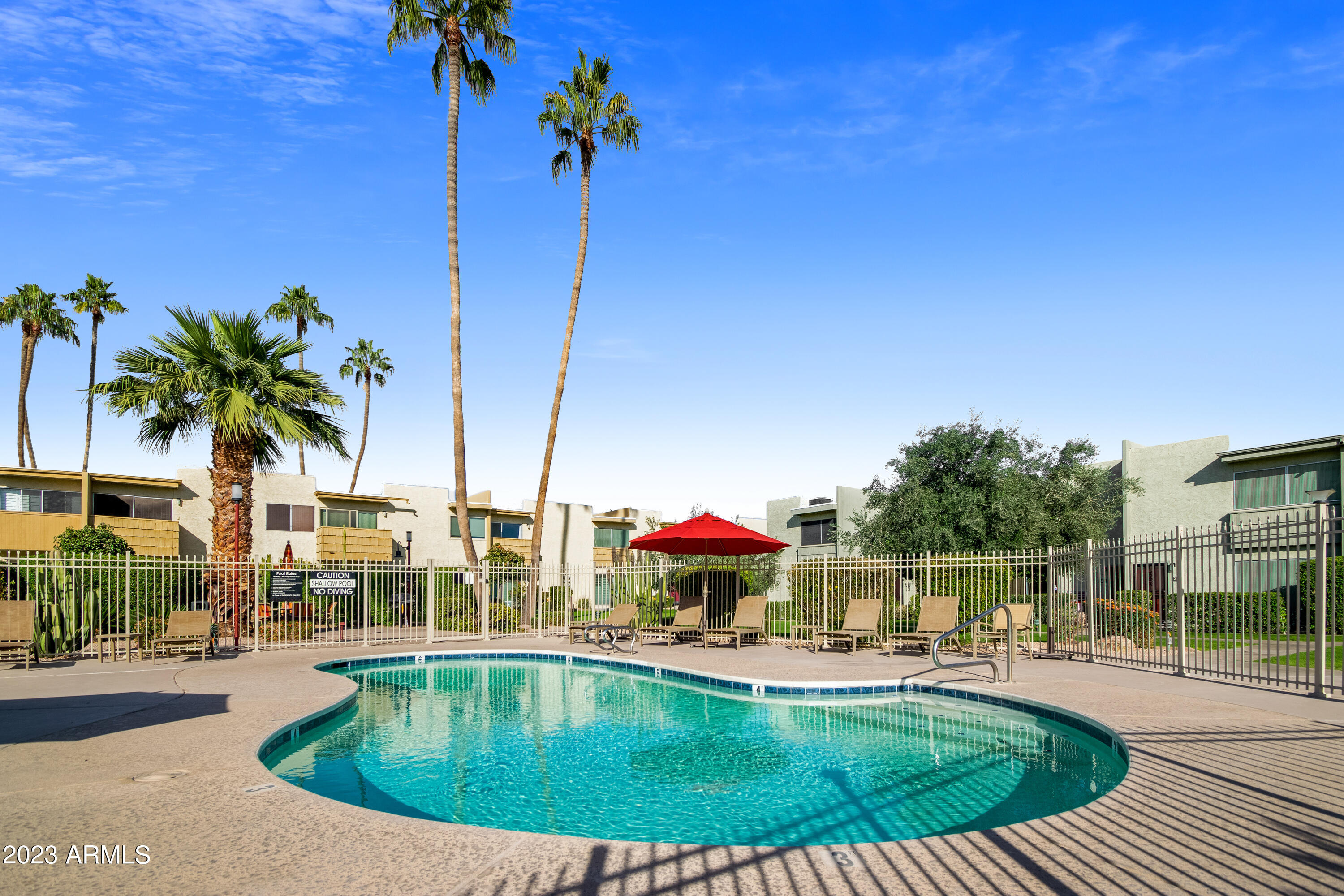 4600 North 68th Street, Unit 356 Scottsdale, AZ 85251 - Photo 1 of 16 a view of a swimming pool with a sitting space