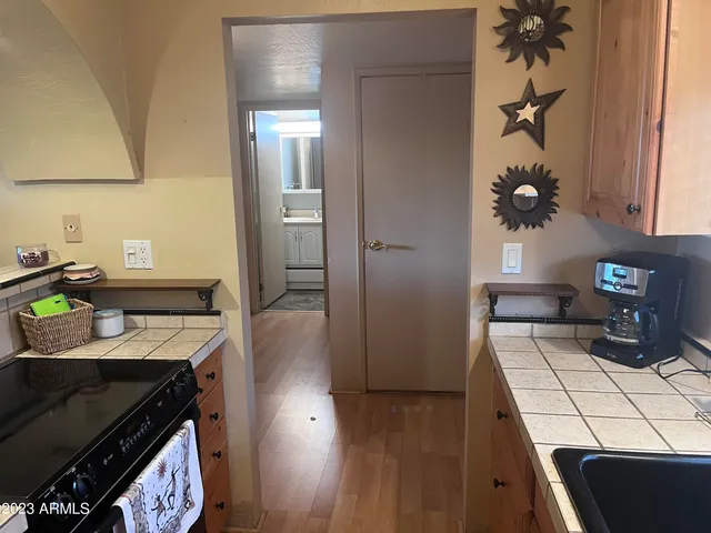 a kitchen with a stove and a refrigerator