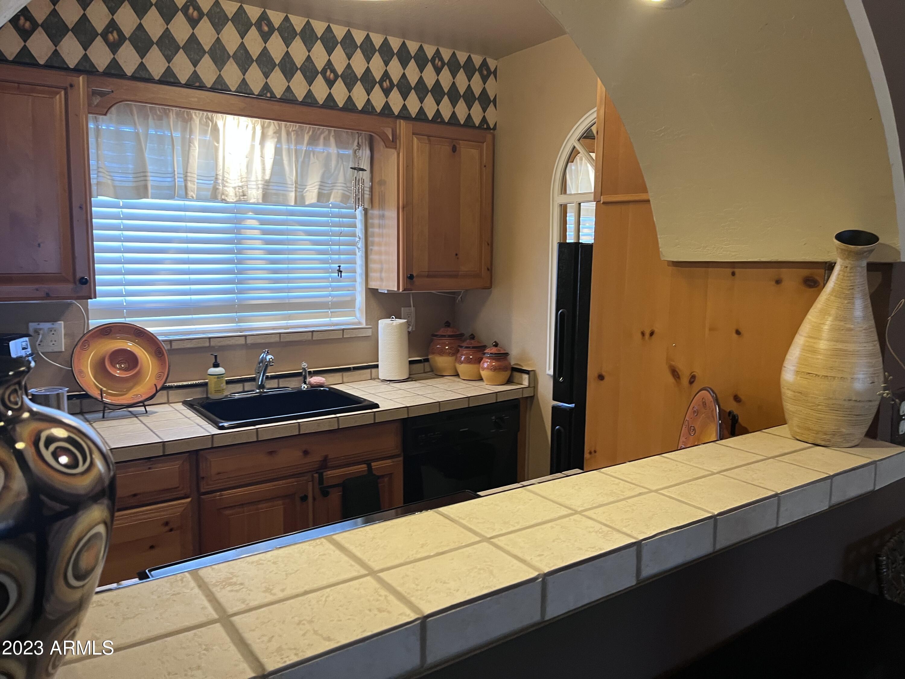 4600 North 68th Street, Unit 356 Scottsdale, AZ 85251 - Photo 10 of 16 a bathroom with a sink and a mirror