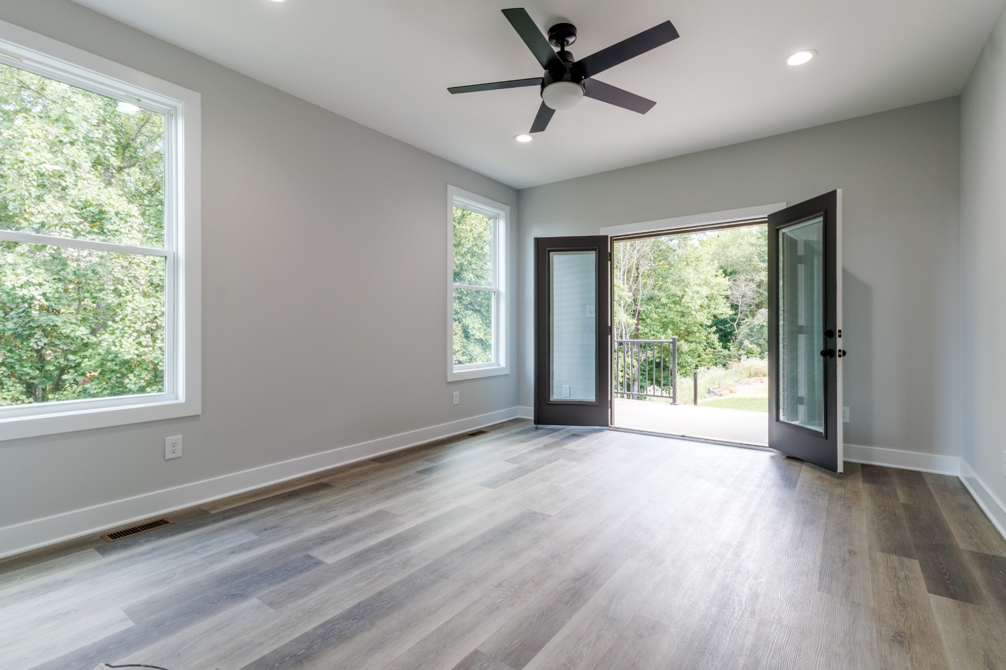 199 Gower Street Pleasant View, TN 37146 - Photo 21 of 38 a view of empty room with wooden floor and fan