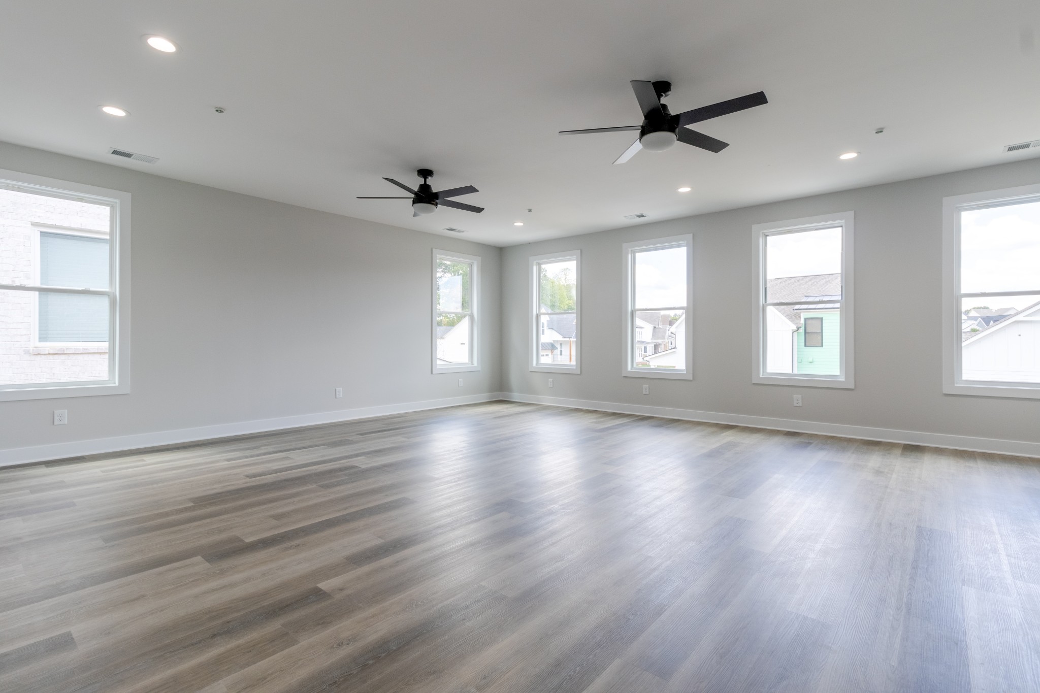 199 Gower Street Pleasant View, TN 37146 - Photo 30 of 38 a view of an empty room with a window and wooden floor