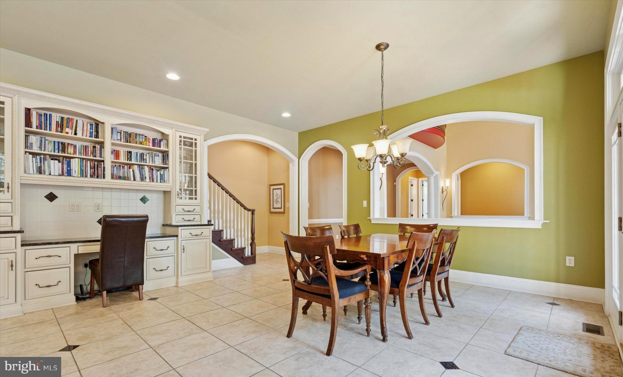 1514 Cherry Lane Rydal, PA 19046 - Photo 13 of 50 a dining room with furniture a rug a fireplace and a chandelier