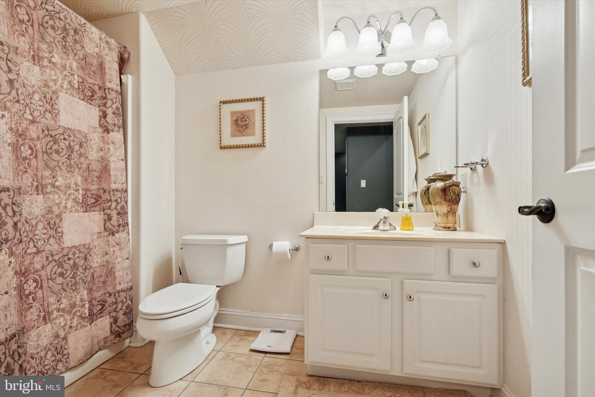 1514 Cherry Lane Rydal, PA 19046 - Photo 30 of 50 a bathroom with a sink vanity mirror and toilet