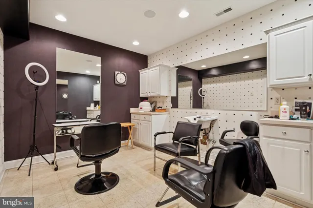 a room with furniture pool table and window