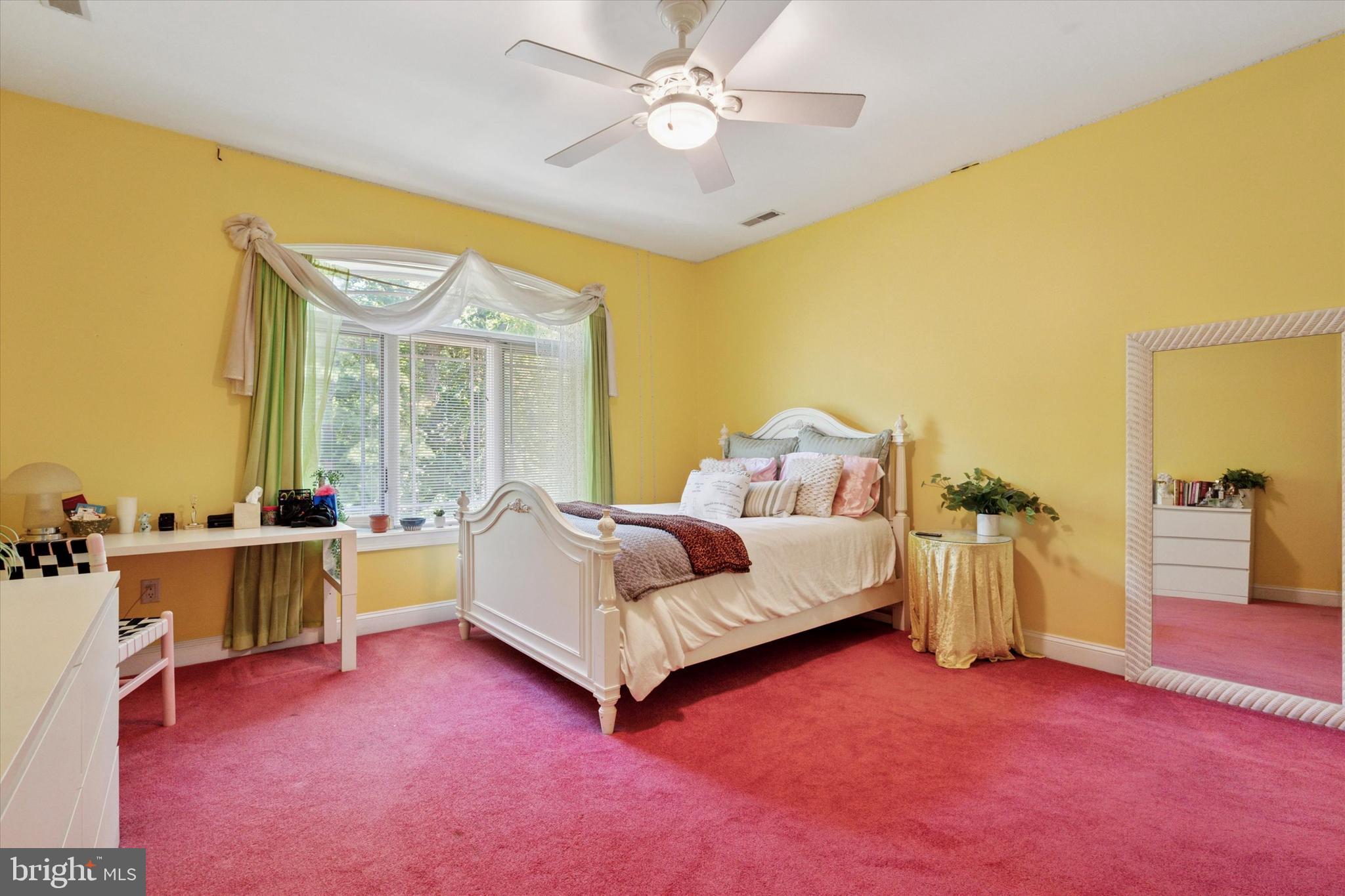 1514 Cherry Lane Rydal, PA 19046 - Photo 37 of 50 a spacious bedroom with a bed and a chandelier
