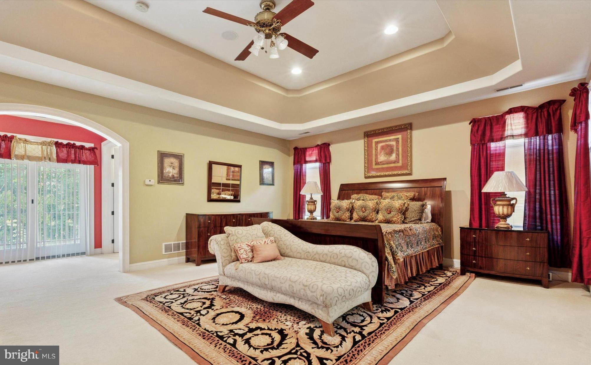 1514 Cherry Lane Rydal, PA 19046 - Photo 42 of 50 a bedroom with a large bed and a chandelier