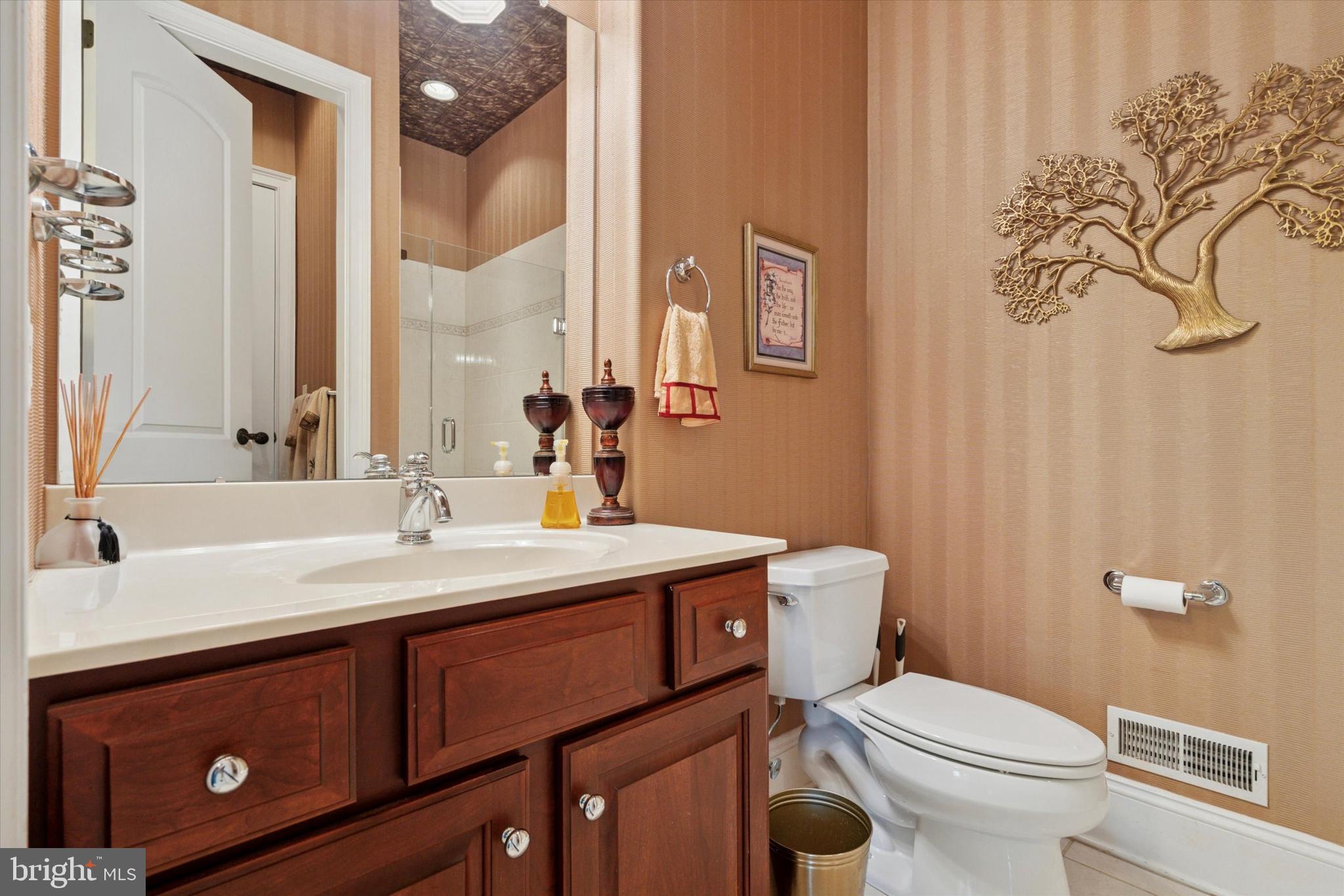 1514 Cherry Lane Rydal, PA 19046 - Photo 6 of 50 a bathroom with a granite countertop toilet sink and mirror