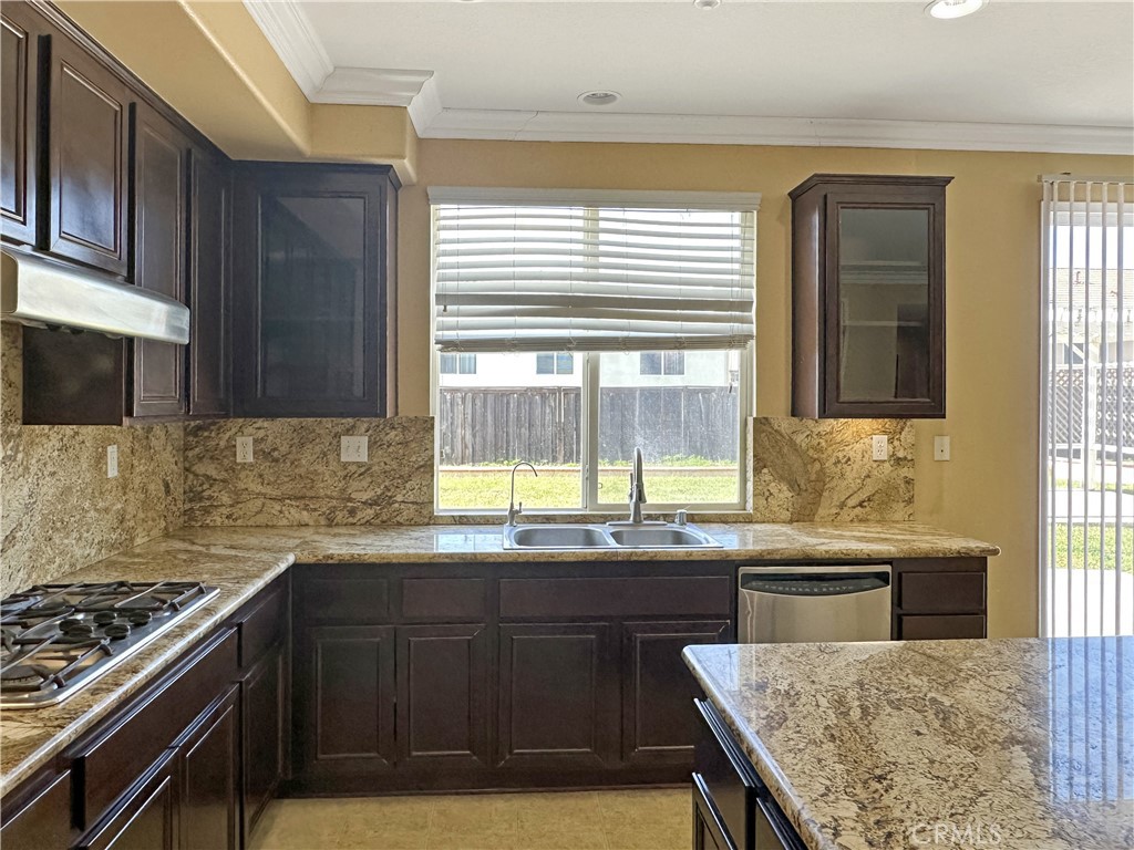 9549 Calico Trail Riverside, CA 92508 - Photo 14 of 46 a kitchen with a stove and a sink
