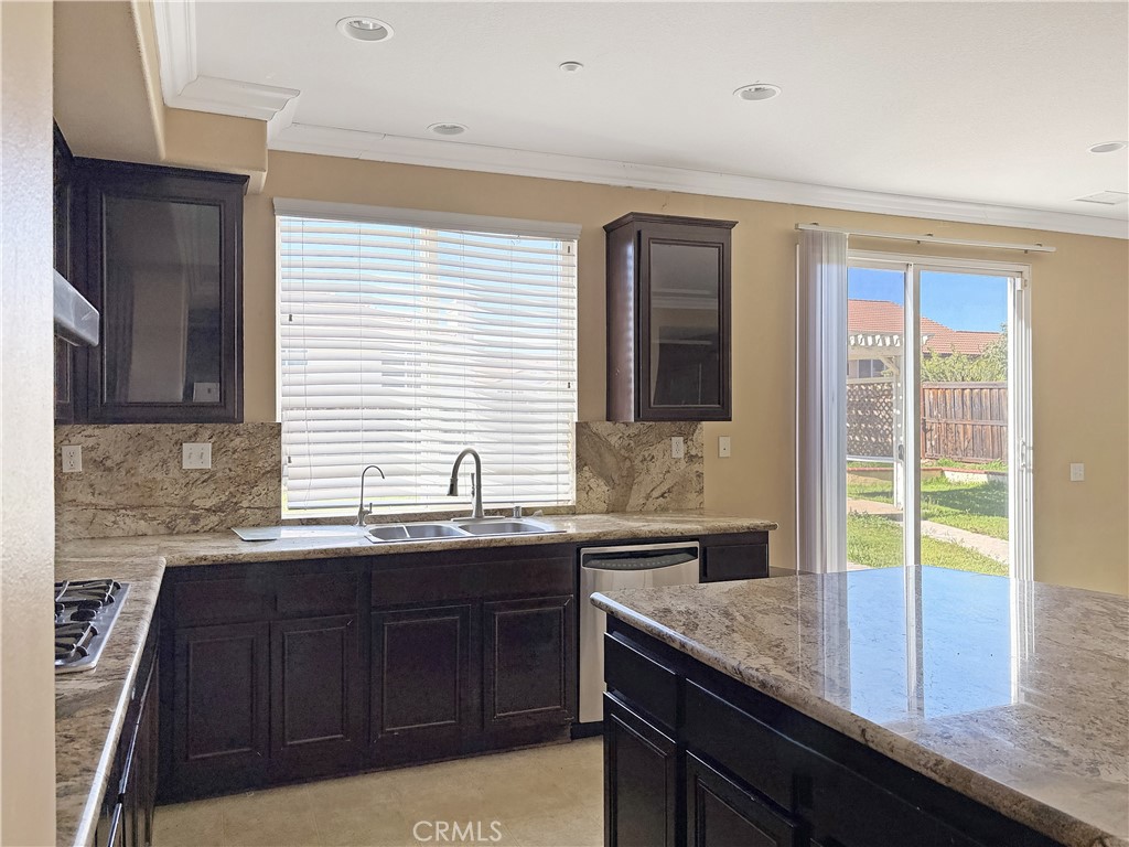 9549 Calico Trail Riverside, CA 92508 - Photo 15 of 46 a kitchen with granite countertop a sink and a window