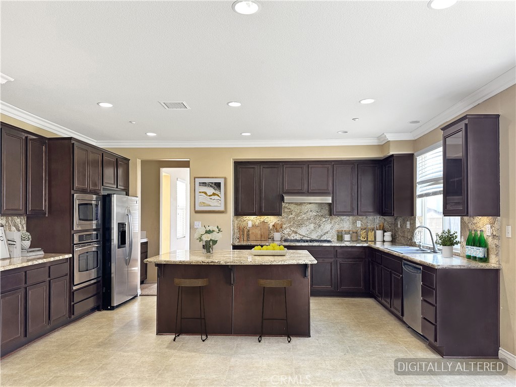 9549 Calico Trail Riverside, CA 92508 - Photo 16 of 46 a kitchen with a refrigerator and a sink