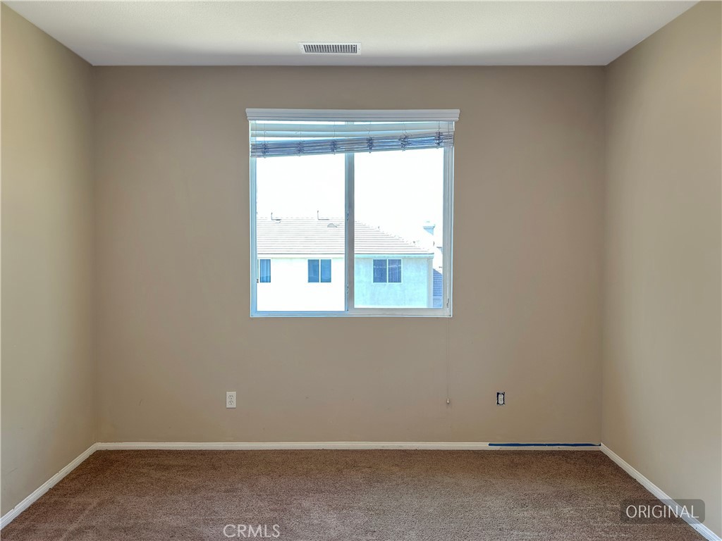 9549 Calico Trail Riverside, CA 92508 - Photo 22 of 46 an empty room with a window