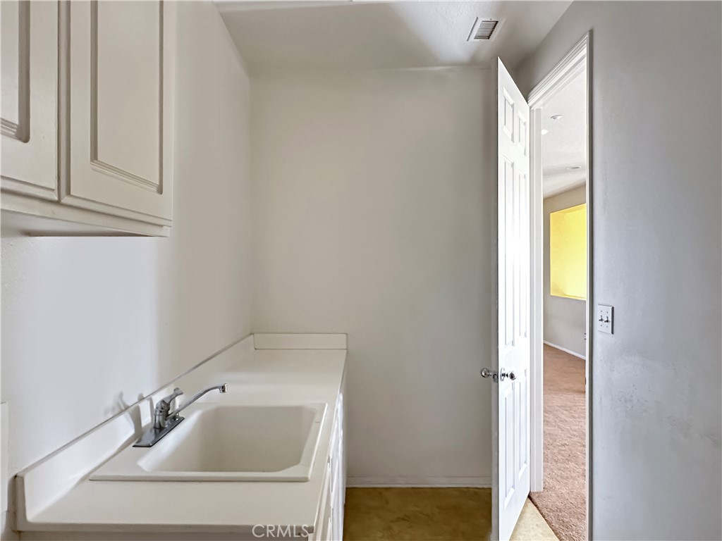 9549 Calico Trail Riverside, CA 92508 - Photo 29 of 46 a bathroom with a sink and a mirror