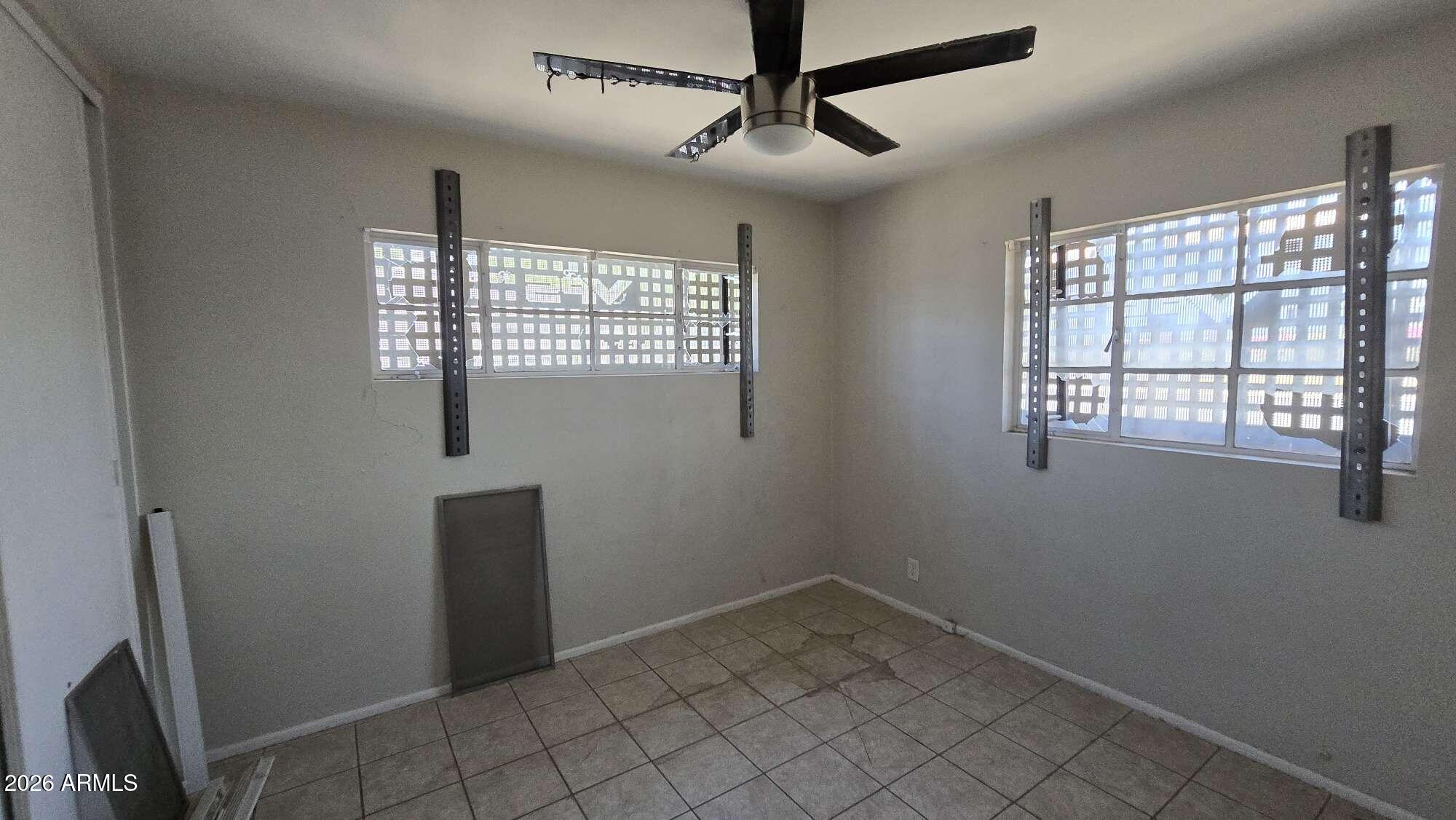 834 West Osborn Road Phoenix, AZ 85013 - Photo 14 of 45 a view of an empty room with a window