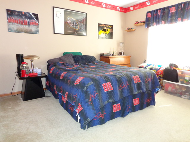 2217 Ashby Lane Plainfield, IL 60586 - Photo 11 of 20 a bedroom with a bed and a painting on the wall