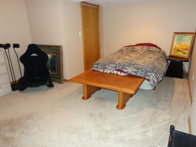2217 Ashby Lane Plainfield, IL 60586 - Photo 15 of 20 a bedroom with a bed and a lamp on table