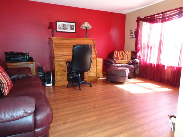 2217 Ashby Lane Plainfield, IL 60586 - Photo 3 of 20 a living room with furniture and a wooden floor