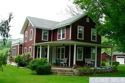 front view of brick house with a yard
