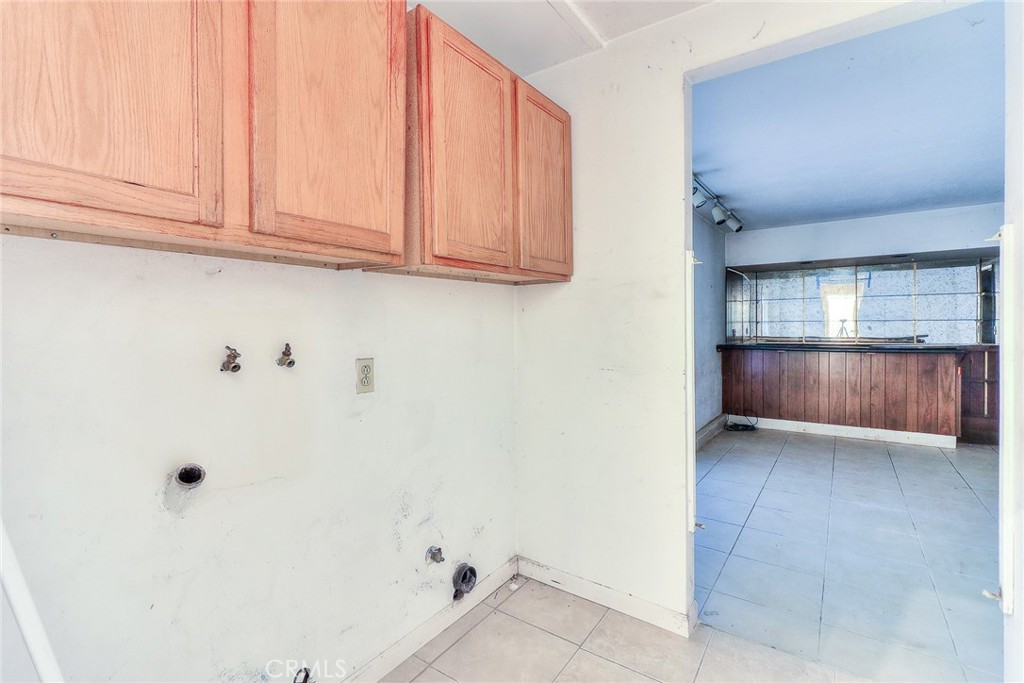 905 Brighton Way Montebello, CA 90640 - Photo 12 of 23 a view of an empty room with wooden floor and cabinet