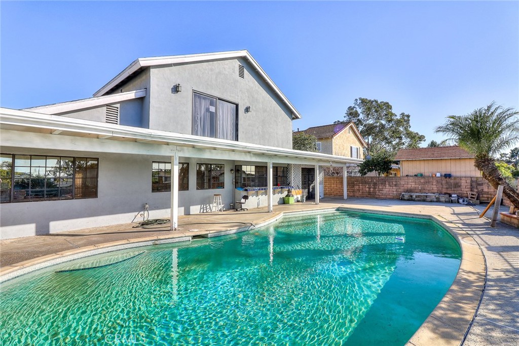 905 Brighton Way Montebello, CA 90640 - Photo 23 of 23 a front view of a house with swimming pool having outdoor seating