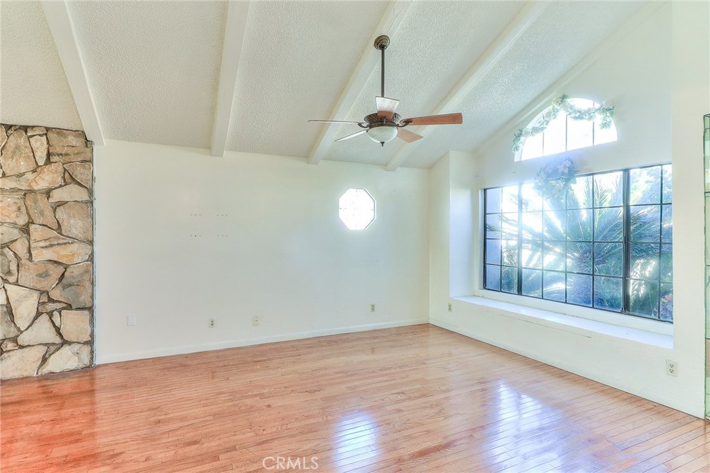 905 Brighton Way Montebello, CA 90640 - Photo 3 of 23 an empty room with wooden floor and windows