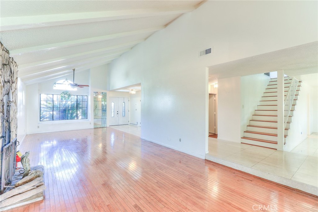 905 Brighton Way Montebello, CA 90640 - Photo 5 of 23 a view of an empty room with wooden floor and a window