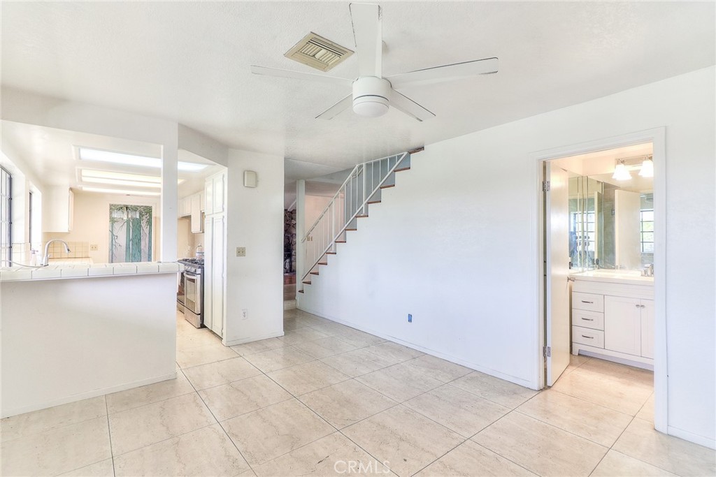 905 Brighton Way Montebello, CA 90640 - Photo 8 of 23 a view of a hallway with wooden floor and a living room