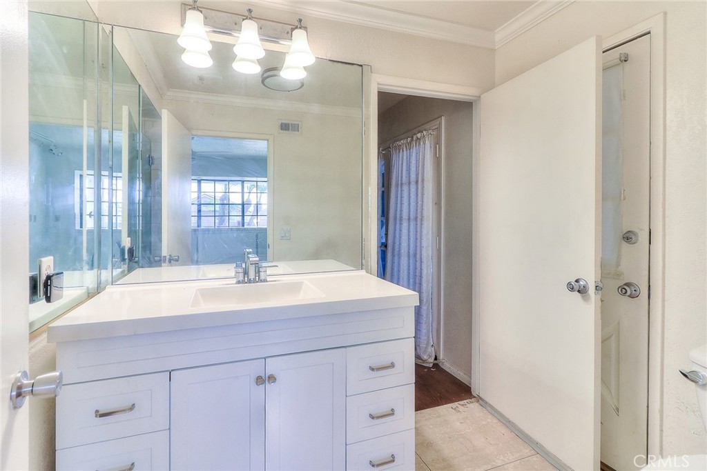 905 Brighton Way Montebello, CA 90640 - Photo 10 of 23 a bathroom with a sink and a mirror