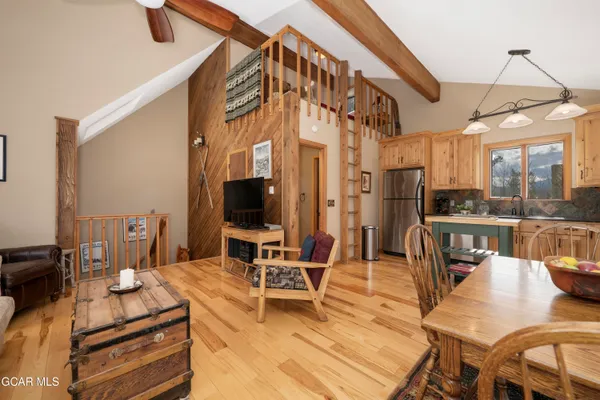 a view of a living room and dining room