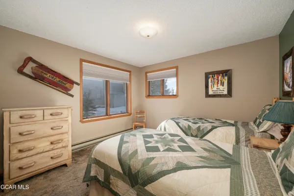 a bedroom with a bed and with closet