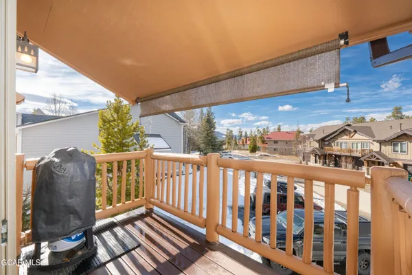 a view of a chairs and table in the balcony