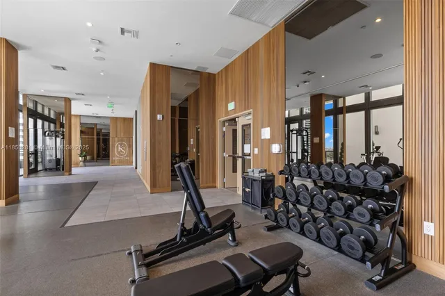 a view of a livingroom with furniture and workspace