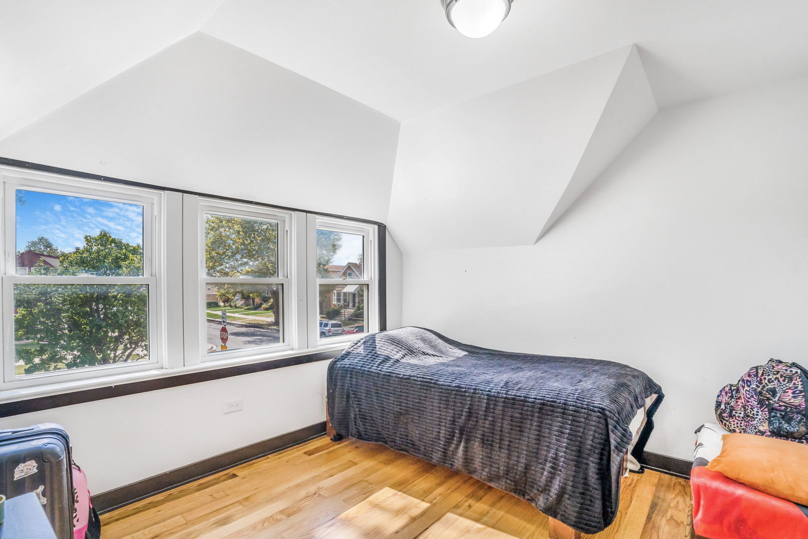 4158 West 58th Place, Unit 4158 Chicago, IL 60629 - Photo 11 of 22 a bedroom with bed and balcony