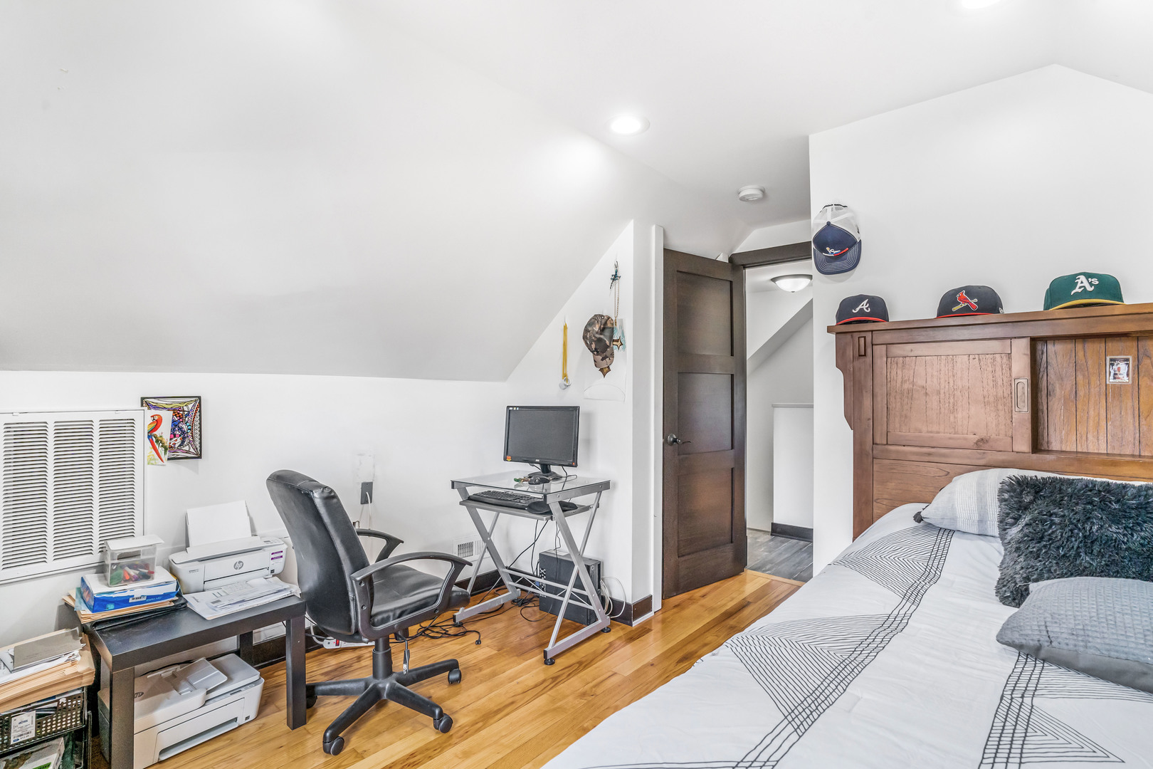 4158 West 58th Place, Unit 4158 Chicago, IL 60629 - Photo 12 of 22 a bedroom with furniture and a wooden floor