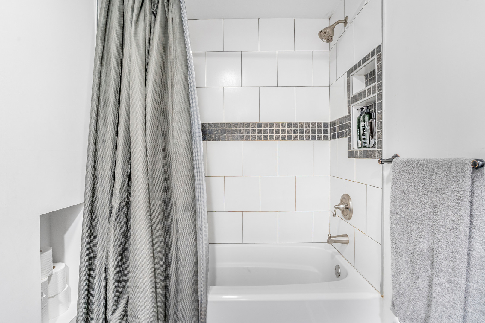 4158 West 58th Place, Unit 4158 Chicago, IL 60629 - Photo 14 of 22 a bathroom with a bathtub and a shower