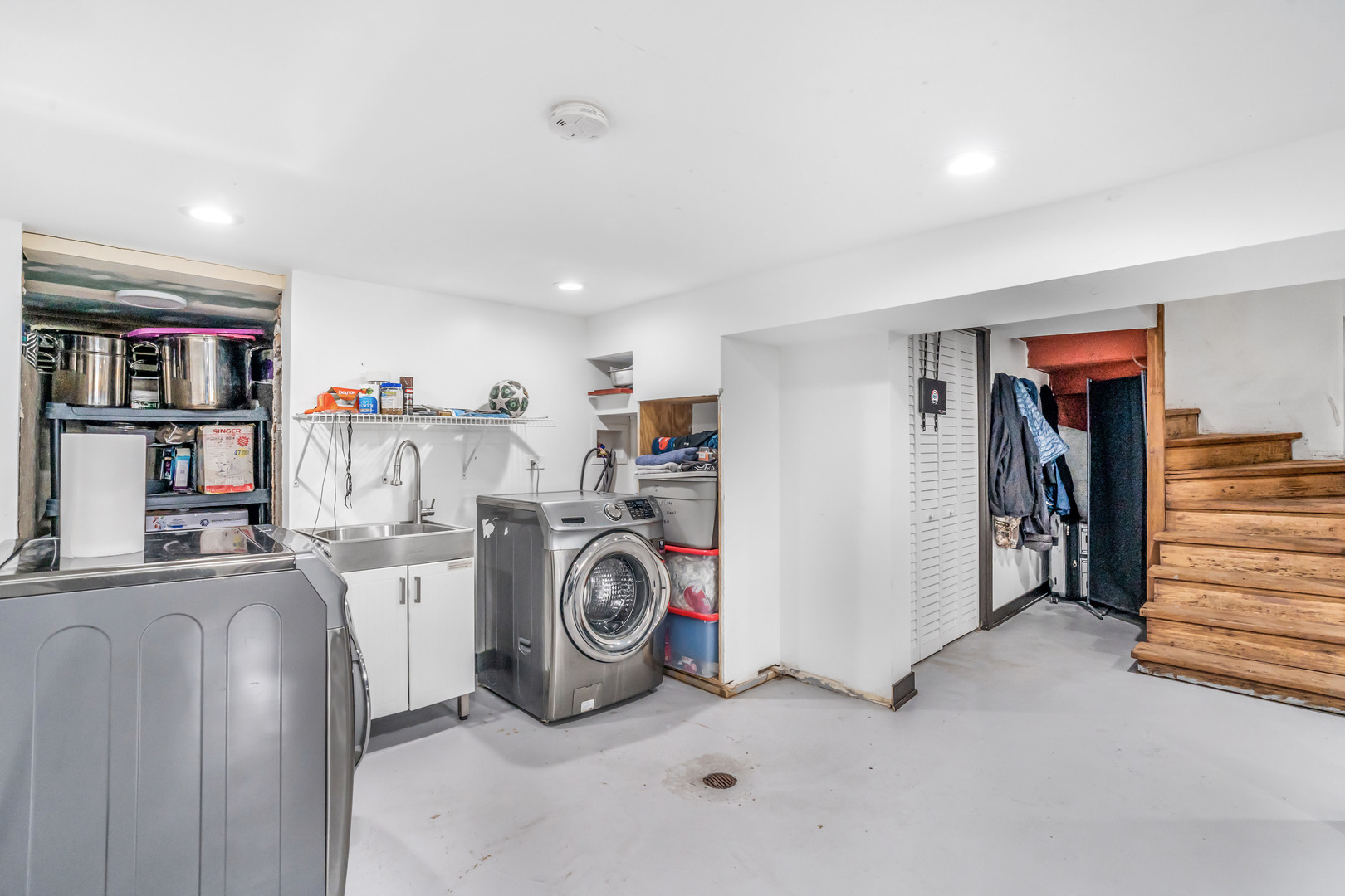 4158 West 58th Place, Unit 4158 Chicago, IL 60629 - Photo 18 of 22 a view of a storage & utility room with washer and dryer
