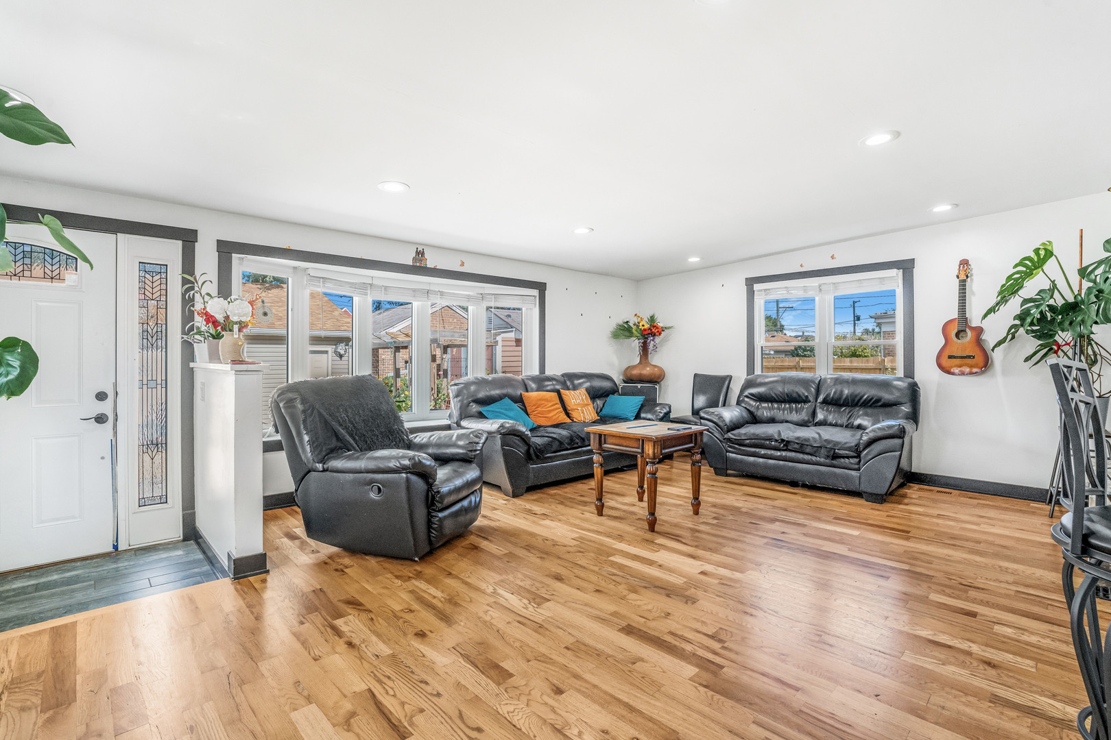 4158 West 58th Place, Unit 4158 Chicago, IL 60629 - Photo 3 of 22 a living room with furniture and a wooden floor