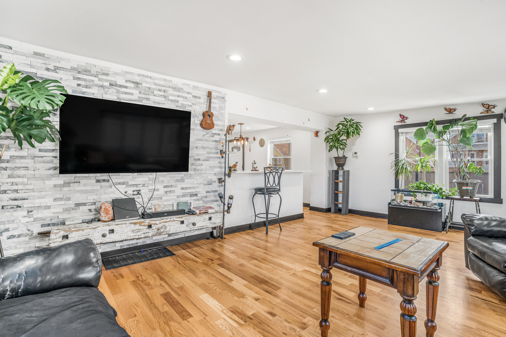 4158 West 58th Place, Unit 4158 Chicago, IL 60629 - Photo 4 of 22 a living room with fireplace furniture and a flat screen tv