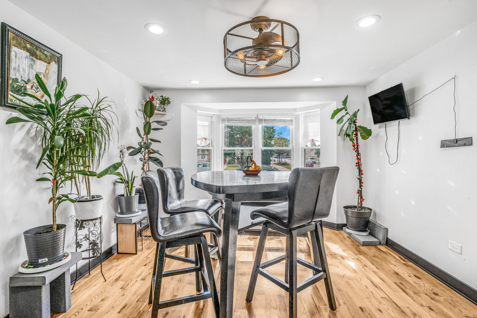 4158 West 58th Place, Unit 4158 Chicago, IL 60629 - Photo 8 of 22 a view of a dining room with furniture window and wooden floor