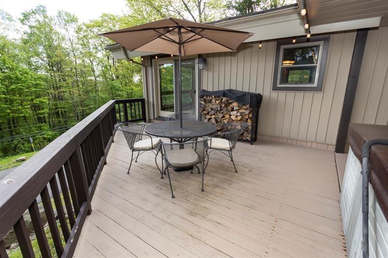 2226 County Line Road Champion, PA 15622 - Photo 12 of 33 a view of balcony with furniture and umbrella