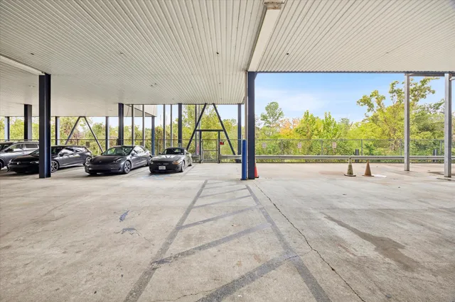 a view of a parking space with a street
