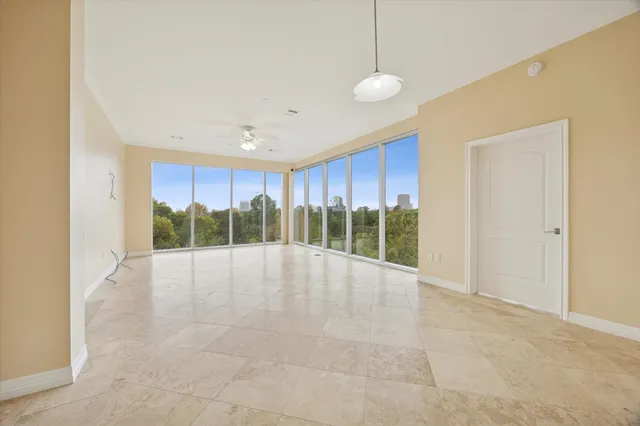 a view of an empty room with windows