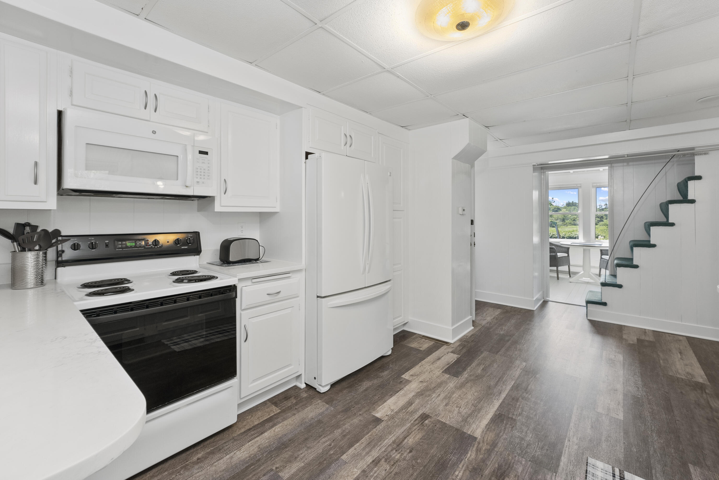 101 Rendezvous Lane Barnstable, MA 02630 - Photo 16 of 33 a kitchen with granite countertop a stove and a refrigerator