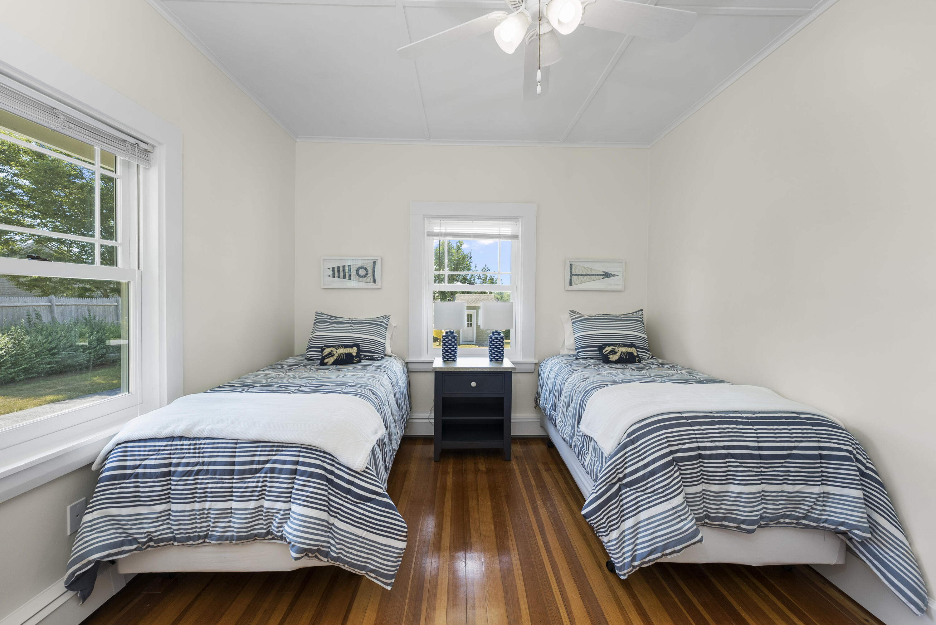101 Rendezvous Lane Barnstable, MA 02630 - Photo 24 of 33 a bedroom with two beds and a large window