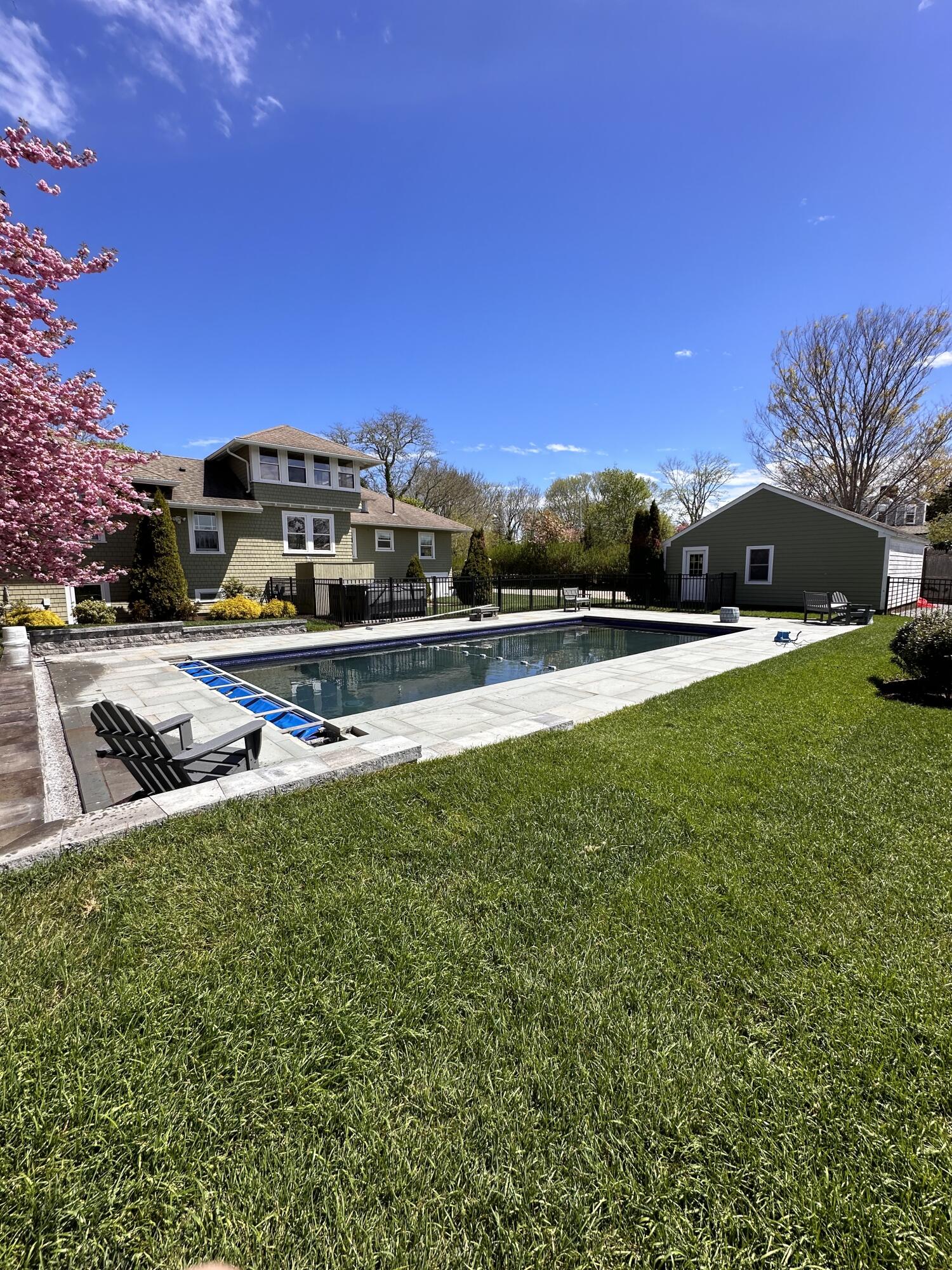 101 Rendezvous Lane Barnstable, MA 02630 - Photo 28 of 33 a view of a swimming pool with an outdoor seating and a many windows