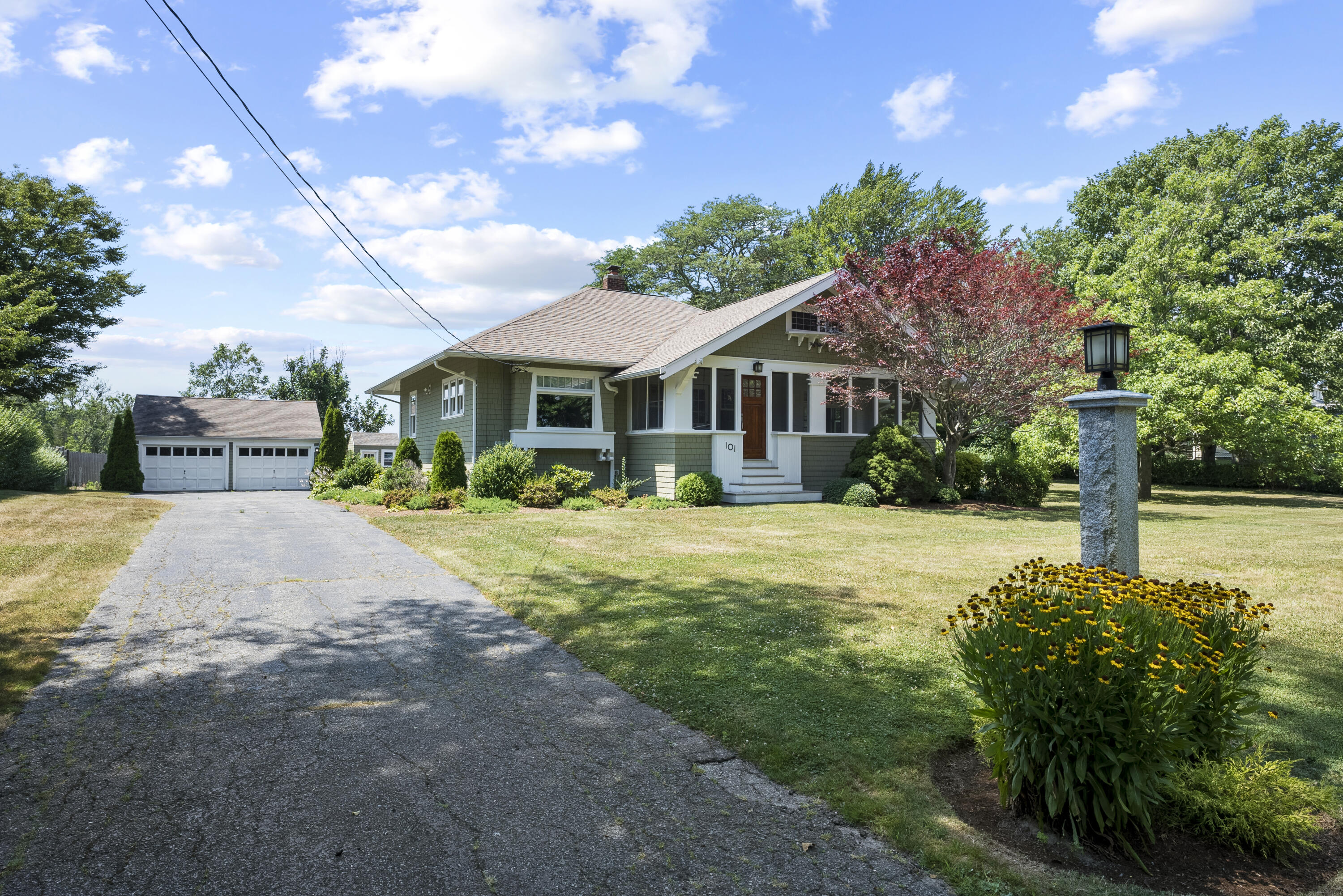 101 Rendezvous Lane Barnstable, MA 02630 - Photo 3 of 33 a front view of a house with a yard and trees